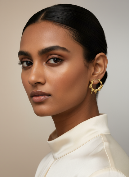 Elegant Indian model wearing gold melting hoop earrings