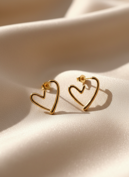 Gold Heart Earrings on Beige Satin