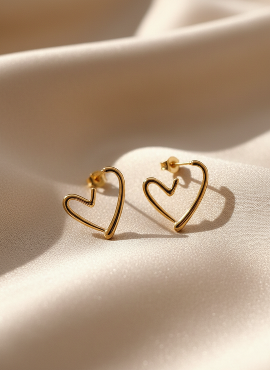 Gold Heart Earrings on Beige Satin
