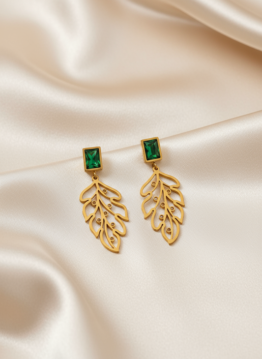 Leaf earrings on light satin cloth