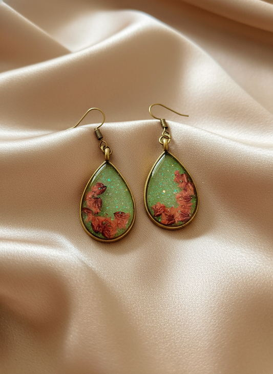 Teardrop pressed flower earrings on satin cloth